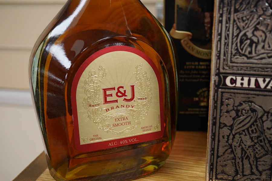 Four bottles of Whisky to include The Glenlivet 12 years aged single malt and two bottles of Glenfiddich, together with a bottle of brandy